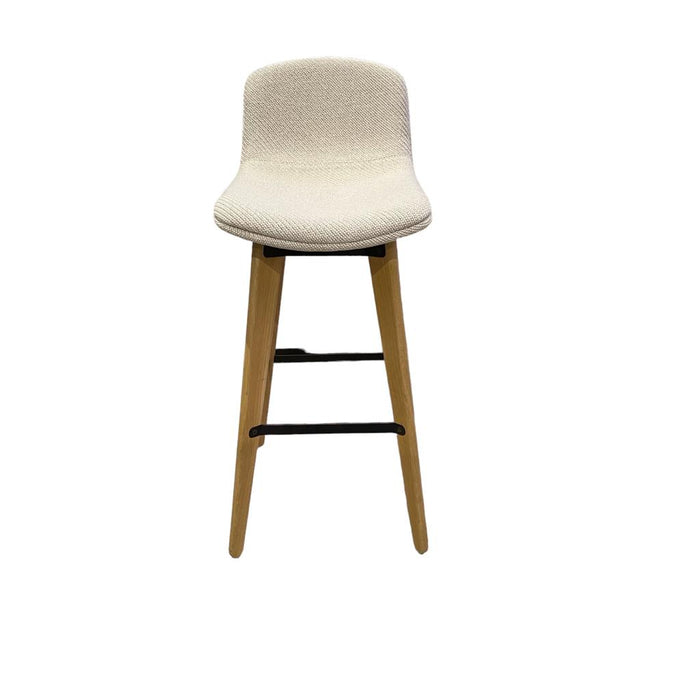 Cream bar stool with knitted upholstery and wooden legs.