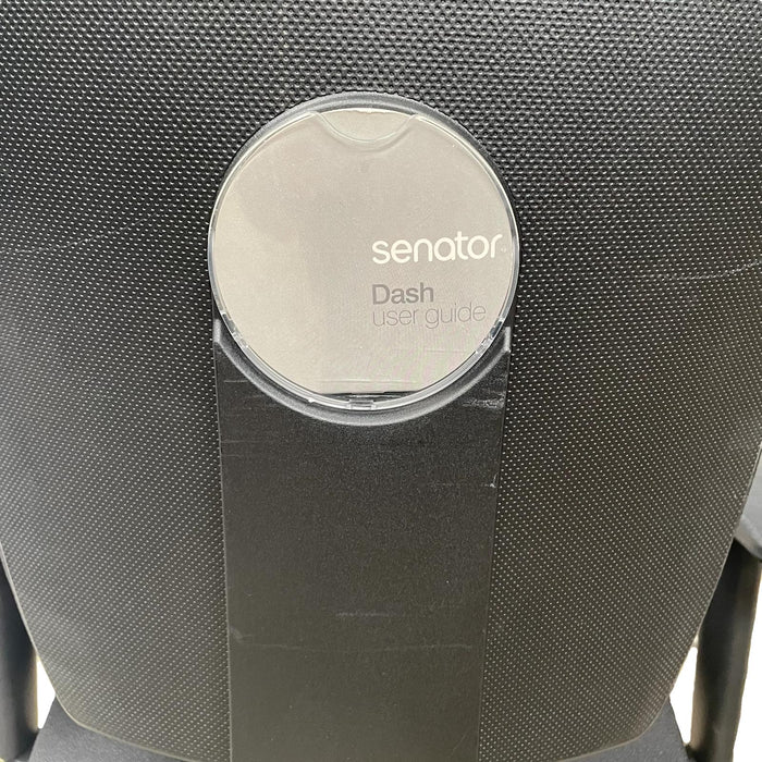 Close up of user guide on the back of a black dash operator Senator chair.