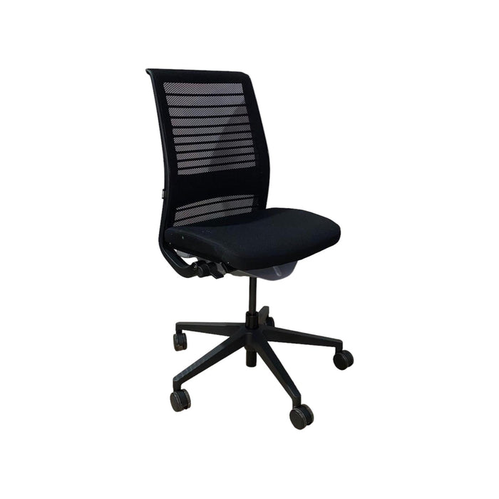 Black Steelcase think V2 armless chair with mesh back, and 5 star base with wheels from the side.